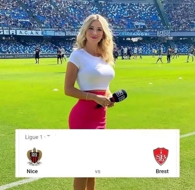 alt="Humorous football meme featuring a female sideline reporter in a white top and pink skirt on a football pitch, with a match graphic below showing a Ligue 1 game between OGC Nice and Stade Brestois 29, implying that the focus is on the reporter rather than the match itself.