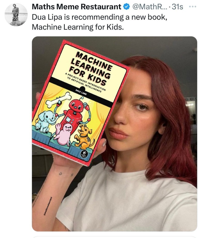 Dua Lipa, with red hair and a serious expression, holds up a red and yellow book titled "Machine Learning for Kids: A Project-Based Introduction to Artificial Intelligence." The image is a screenshot of a tweet from @MathsRestaurant, stating "Dua Lipa is recommending a new book, Machine Learning for Kids."