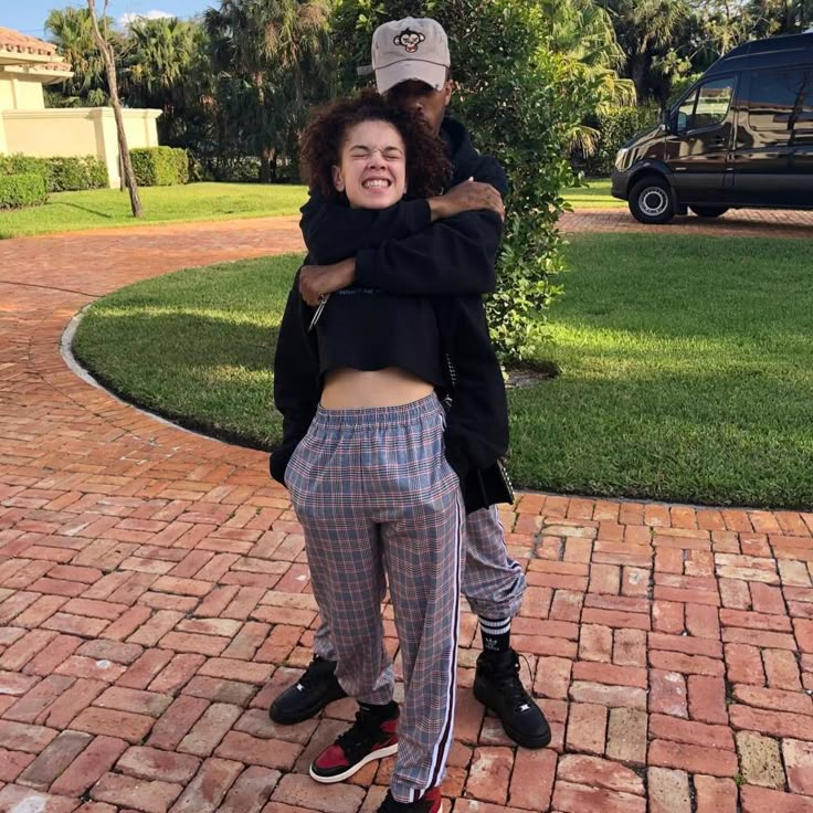 XXXTentacion spending time with family and friends while working on music, sharing quiet moments with his girlfriend Jenesis between 8 a.m. and 2 p.m. on his final day.