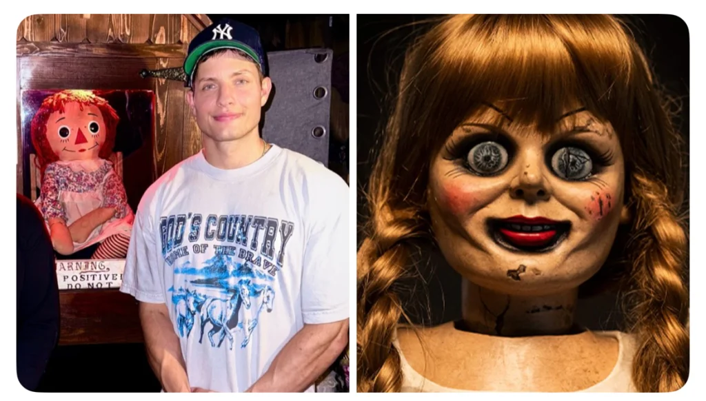 Comedian Matt Rife standing in front of the historic Conjuring house, now the owner of the haunted property, holding the original Annabelle doll surrounded by shelves of cursed artifacts.