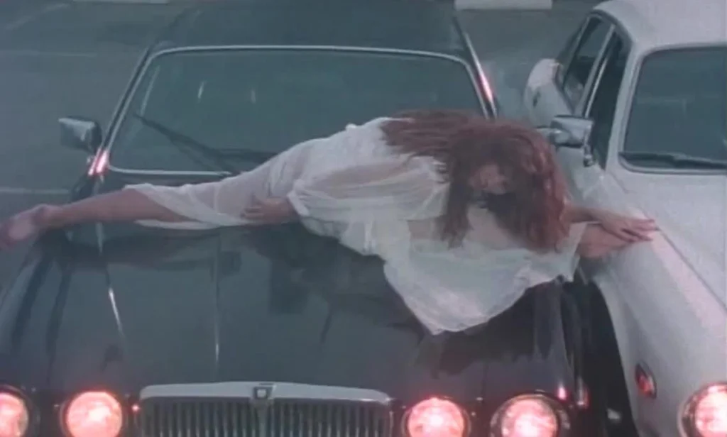Tawny Kitaen dancing on a car in Whitesnake’s “Here I Go Again” video