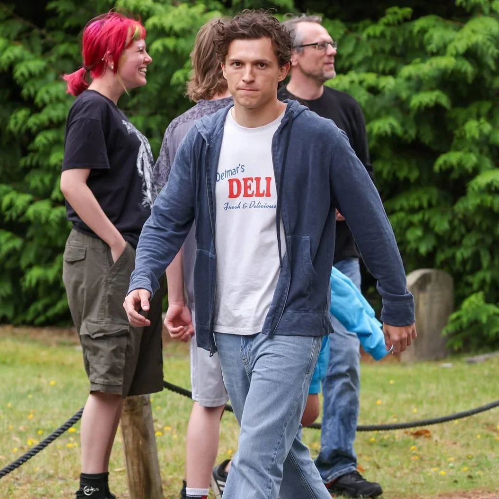 Spider-Man team filming action in London, crew and urban set visible.