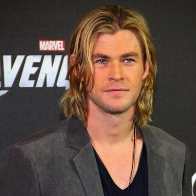 Chris Hemsworth smiling at a red carpet event