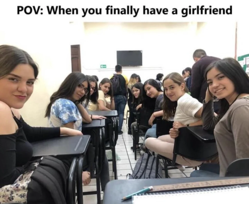 Funny classroom meme showing students facing each other with caption about having a girlfriend.