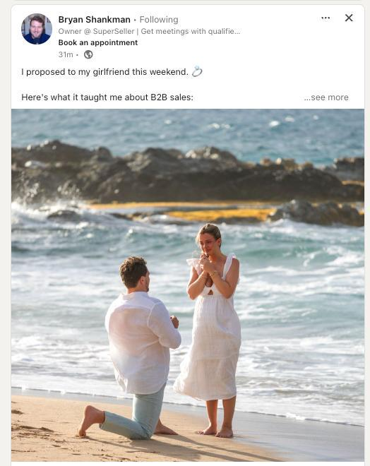 A man gives a ring to a woman on the beach. She looks happy and surprised. The post talks about how this moment teaches something about business sales.