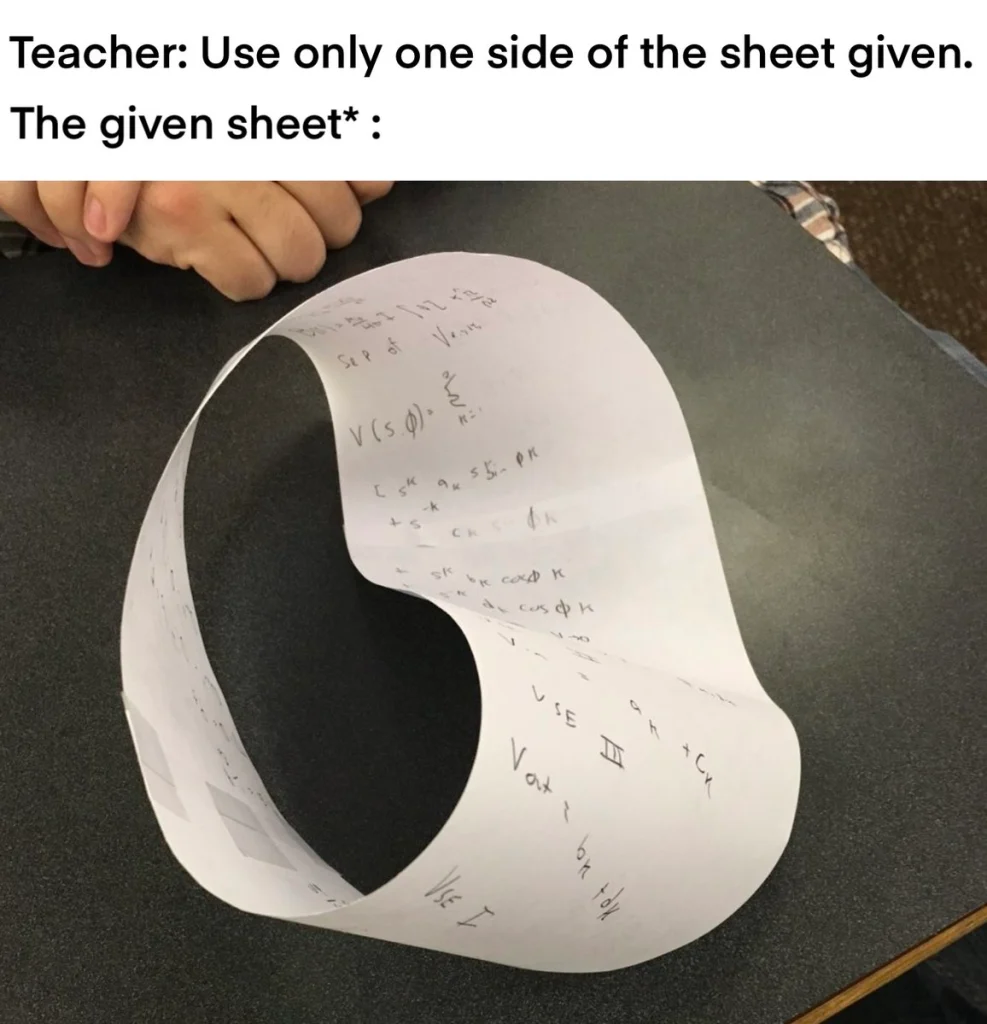 A paper folded into a Möbius strip with math written on it. Joke about using “one side only.”