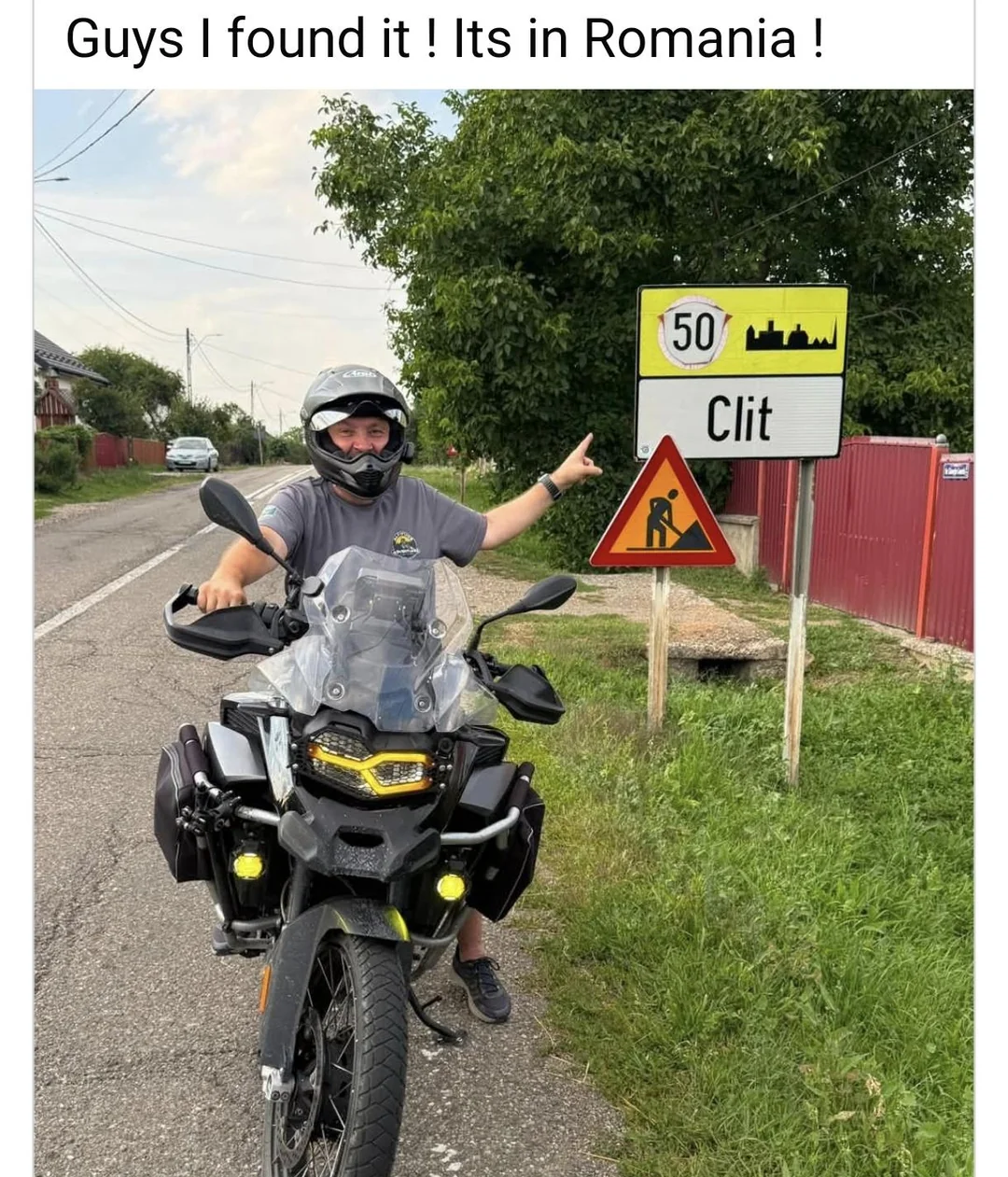 Biker pointing to Clit town sign in Romania meme